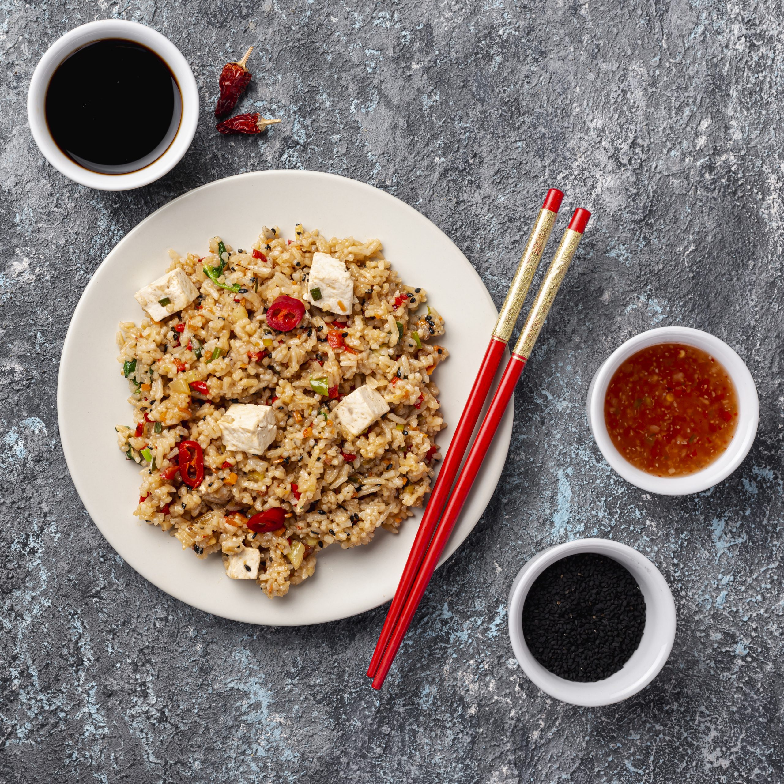 top-view-rice-with-vegetables-soy-sauce-chopsticks